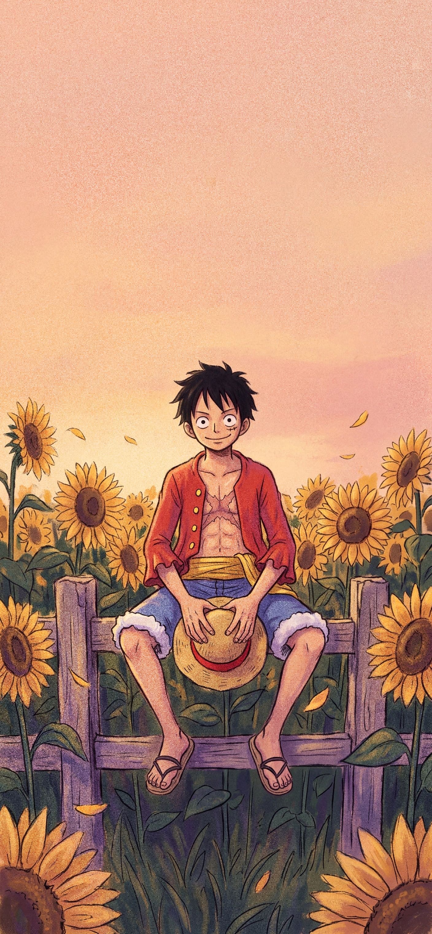 Monkey D. Luffy phone wallpaper: Luffy sitting on a wooden fence in a sunflower field at golden hour, holding his straw hat